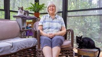 Patricia Sawin with her two cats.