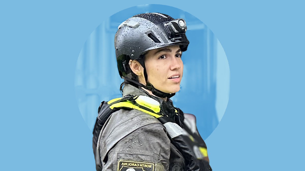 Photo of Dr. Mariecely Luciano-Feijoo in rescue gear placed above a Carolina Blue background.